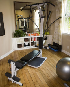 Compact home gym machine using cable pulleys and Power Rods for resistance