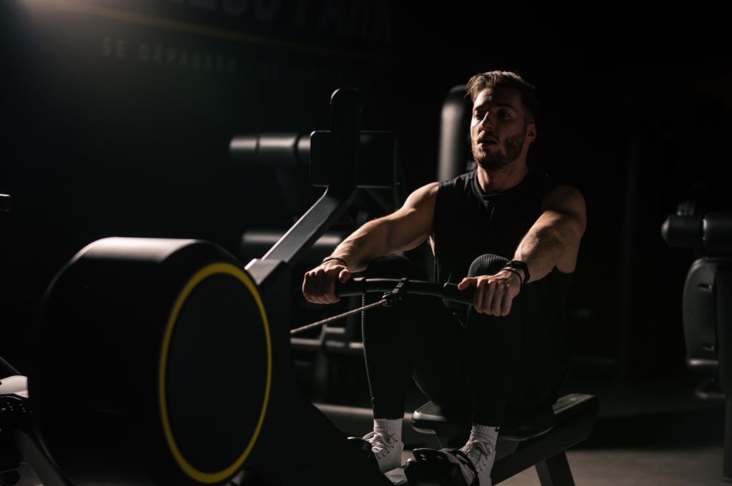 Man racing on indoors rower