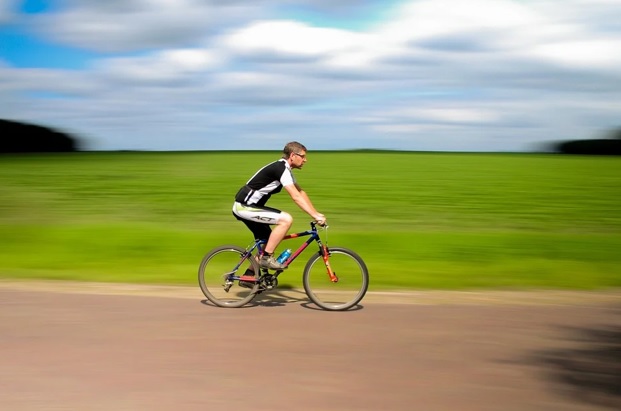 Man cycling on road