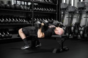 Man performing dumbbell press