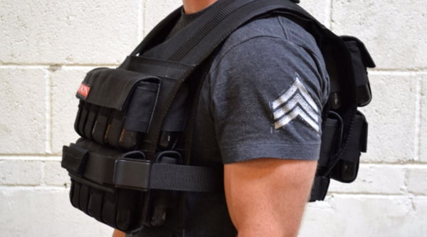 Man standing in weighted vest