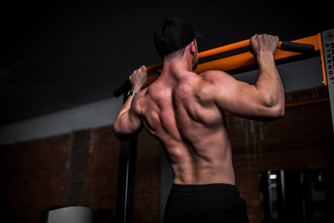 man performing a pull up work out