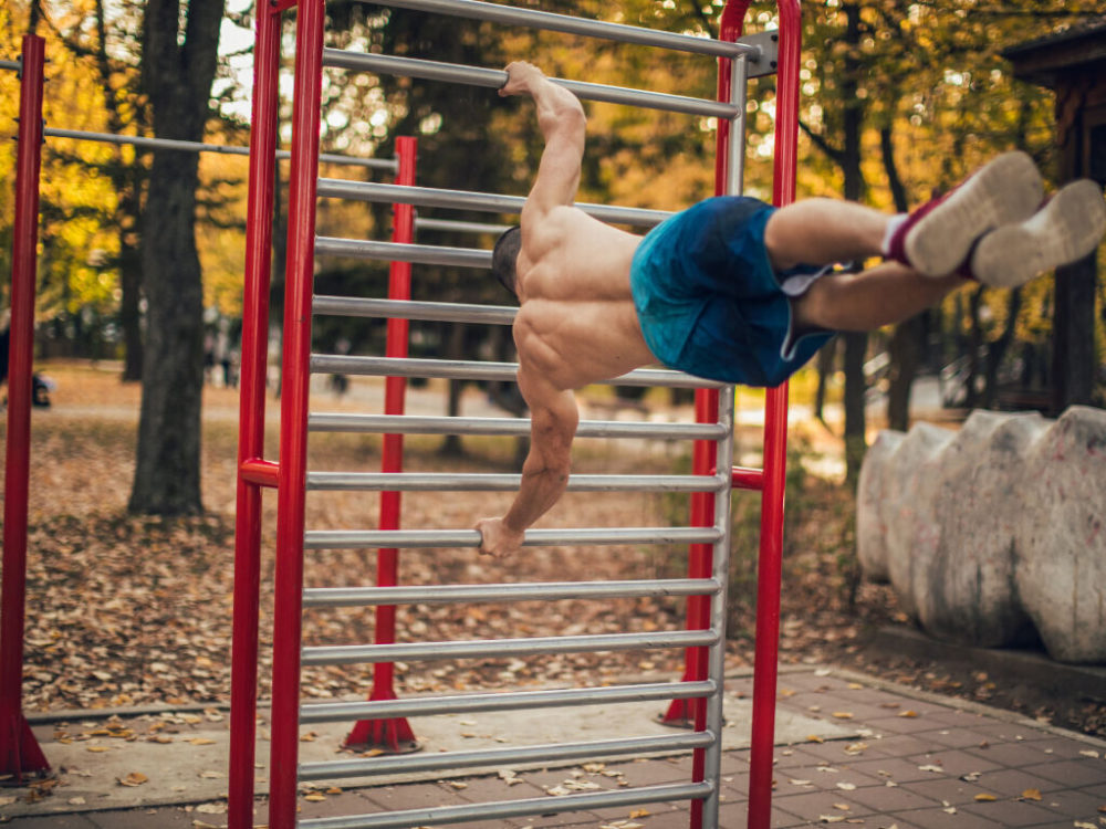 man doing human flag