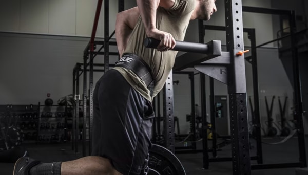 man performing weighted dips