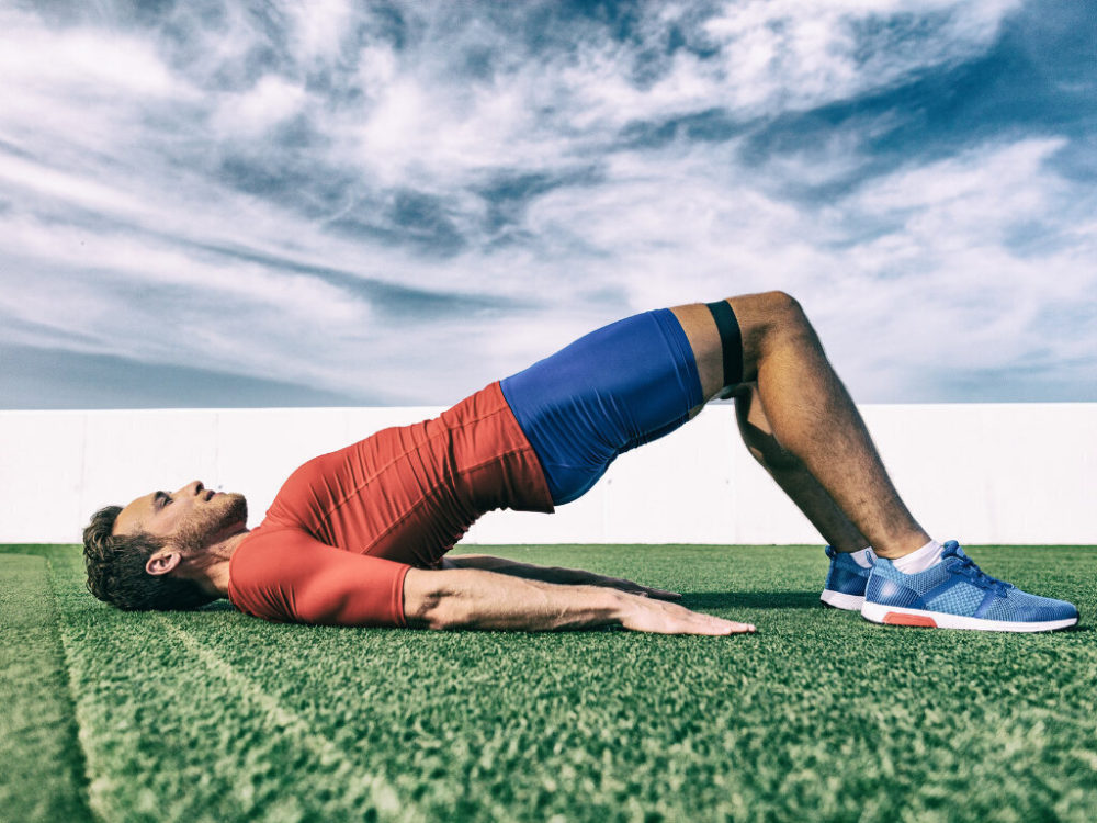 man doing glute bridges