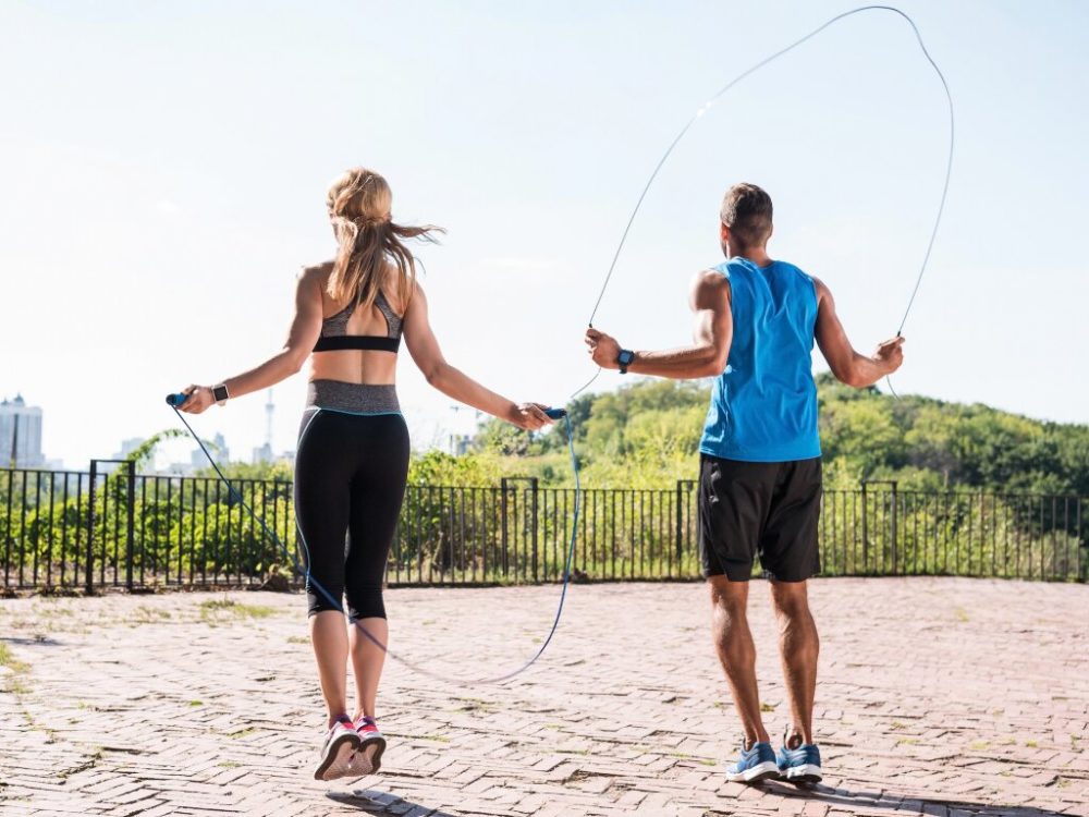 man and woman skipping together