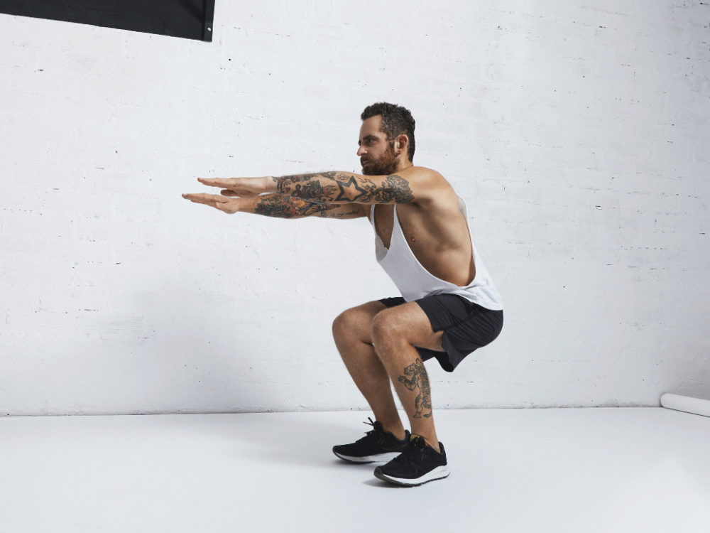 man doing squats