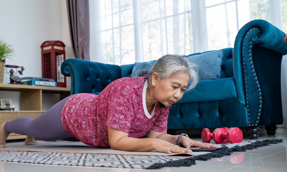 senior citizen doing a plank at home