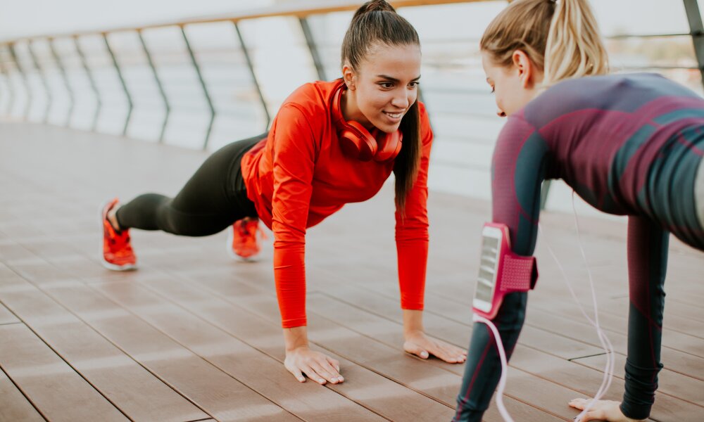 two ladies doing strong planks