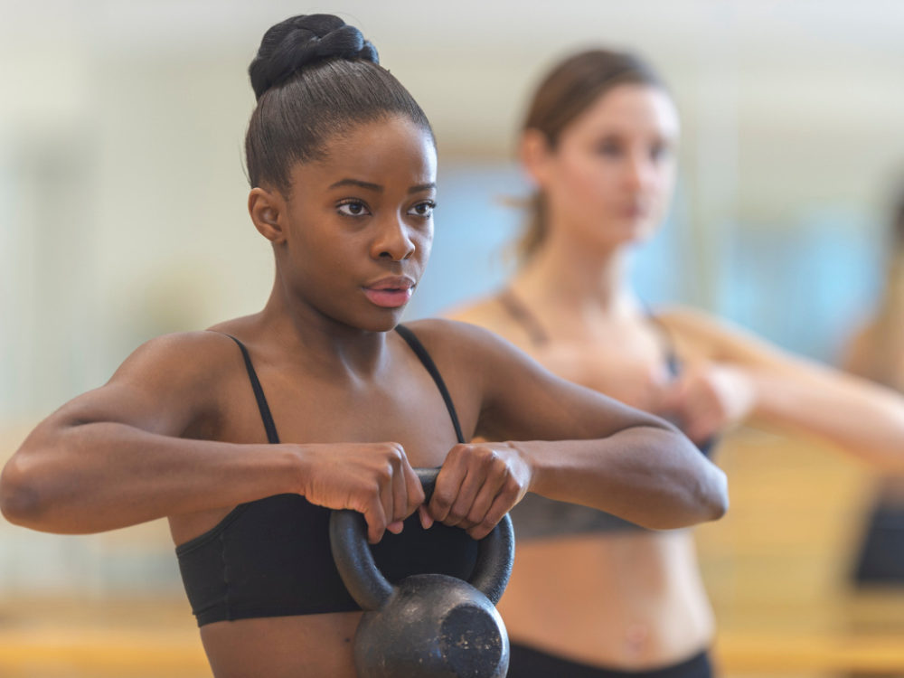 woman using kettlebell