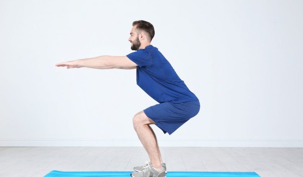 man doing squats
