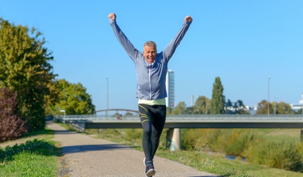 man running with arms elevated