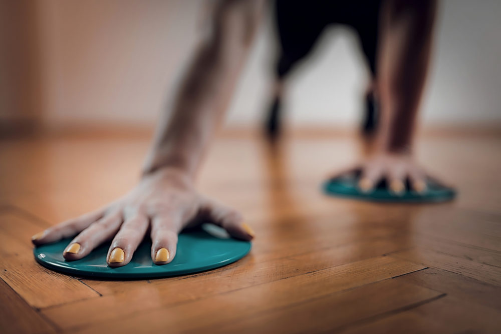 Lady with painted nails using exercise s