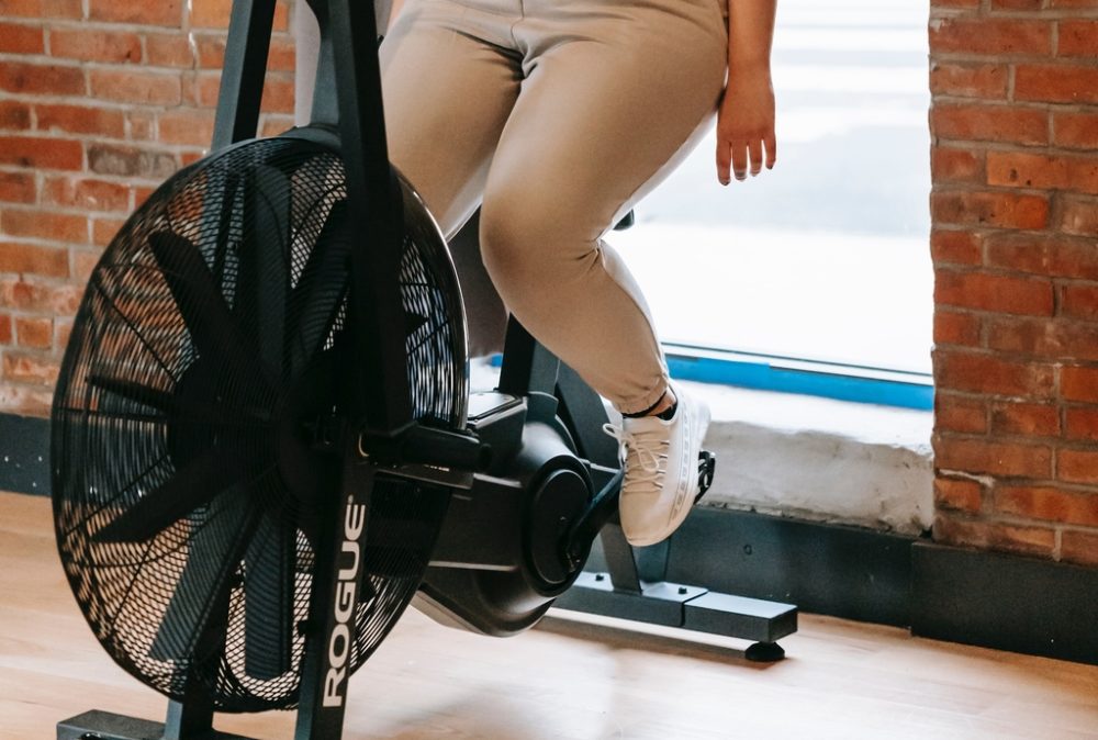 Person resting on echo bike