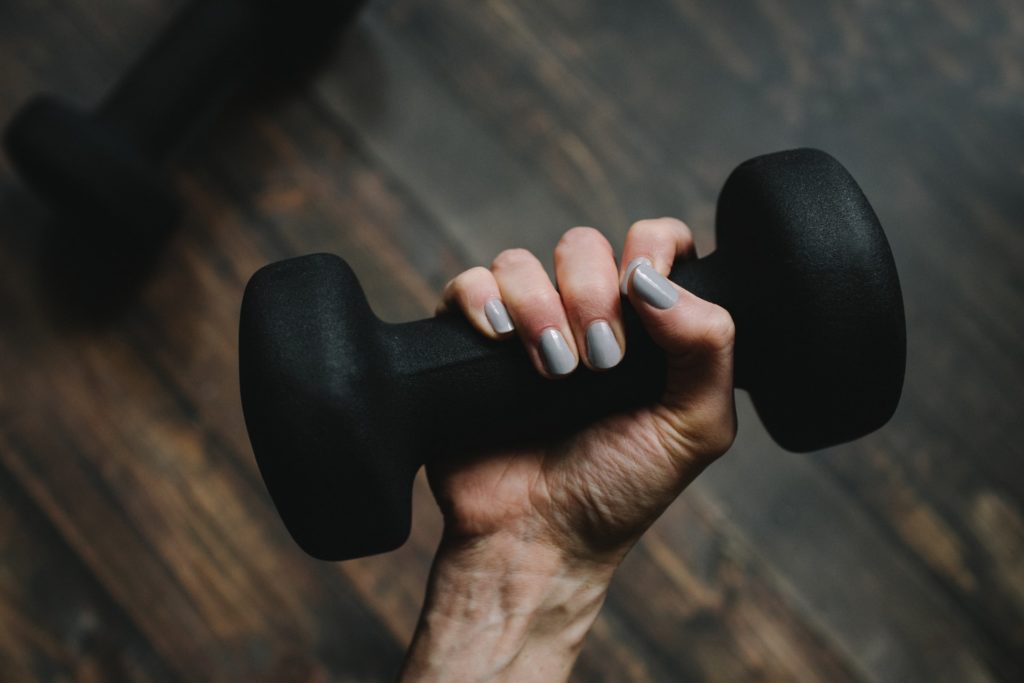 Person with dumbbell in hand