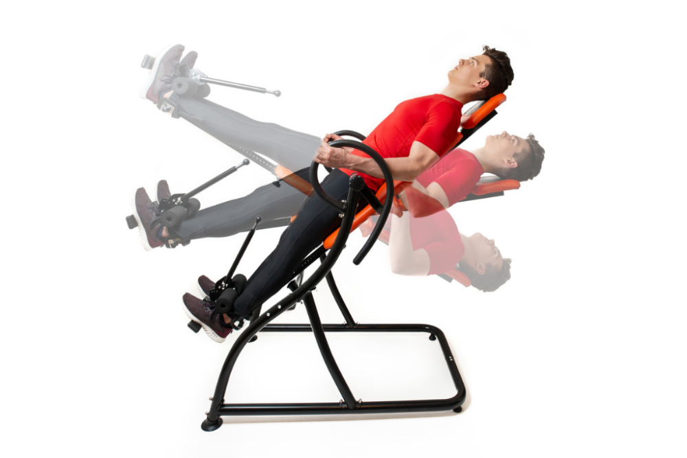 Diagram showing man at different stages of inversion on best inversion table