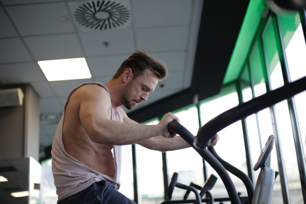 Person working hard on stationary bike
