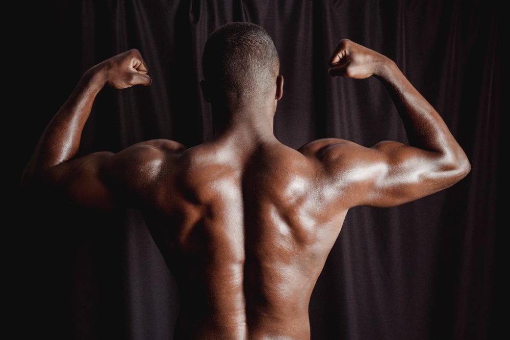 Man showing his back and arms