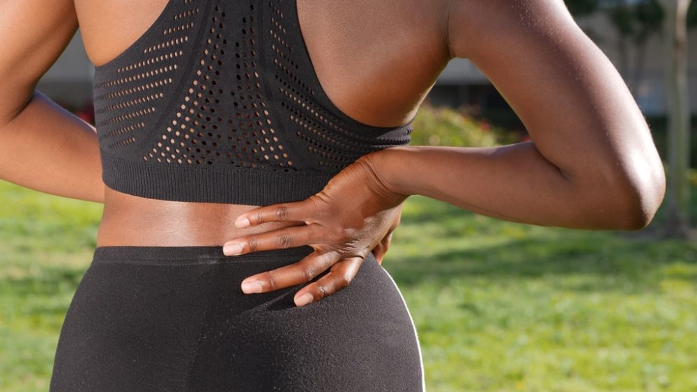 Woman experiencing lower back pain