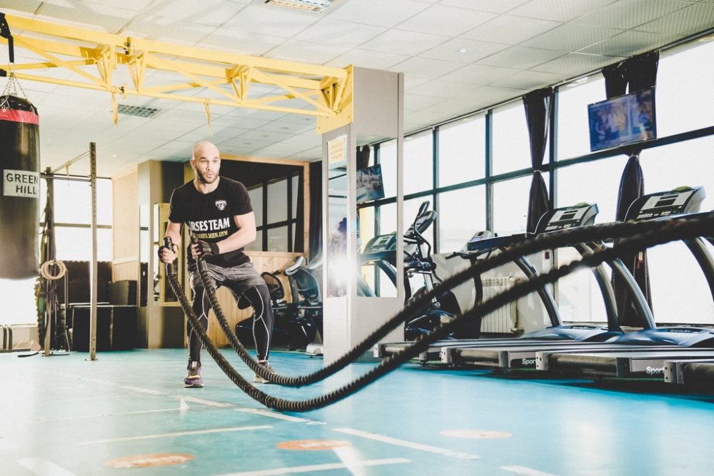 Man working out in colorful gym