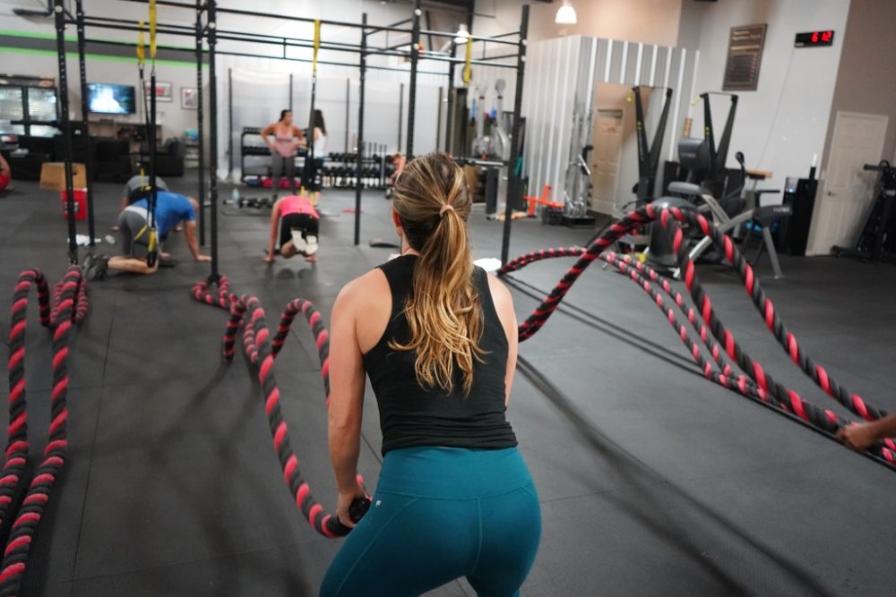People training functional fitness in gym