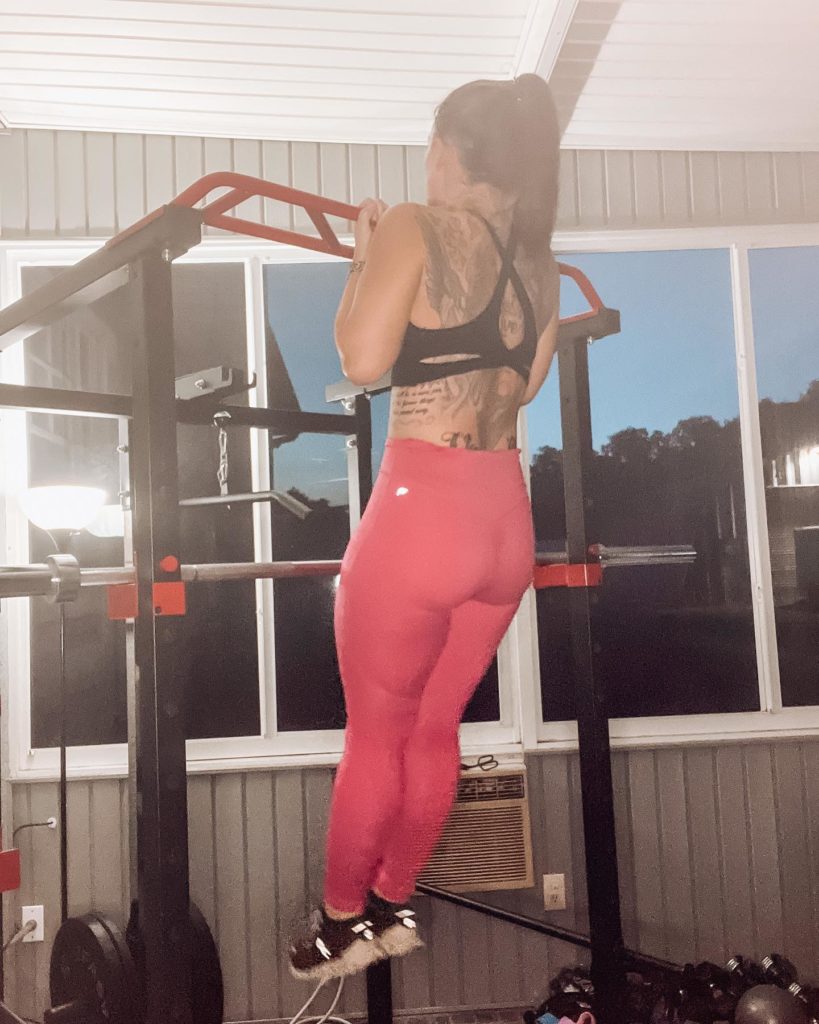 Woman doing pull up on IFAST Power Cage