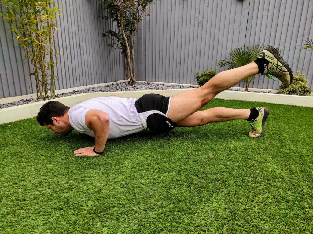 Man doing one leg lifted pushups
