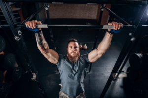Man engaging in bicep calisthenics movement