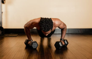 Man exercising forearms in calisthenics
