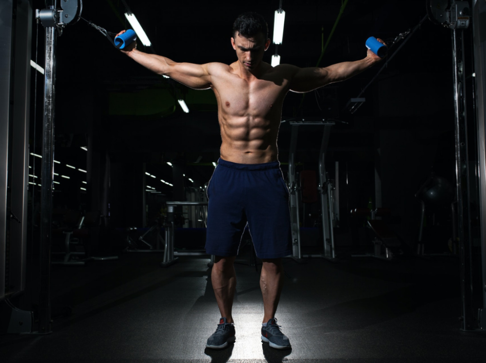 Man doing cable chest flyes
