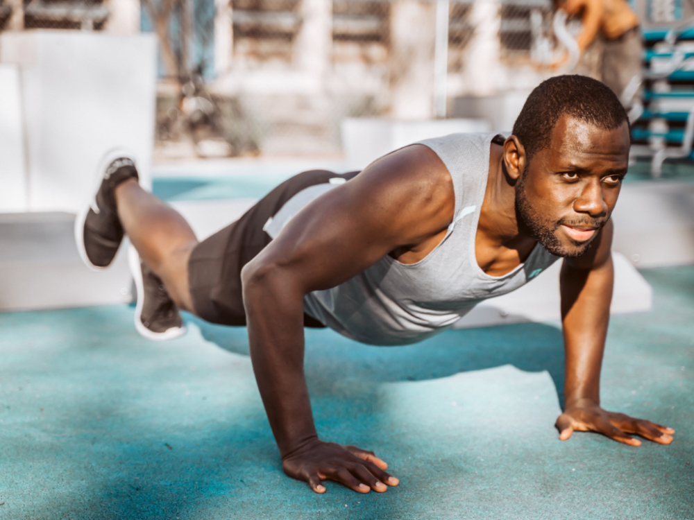 Man attempting a planche push-up