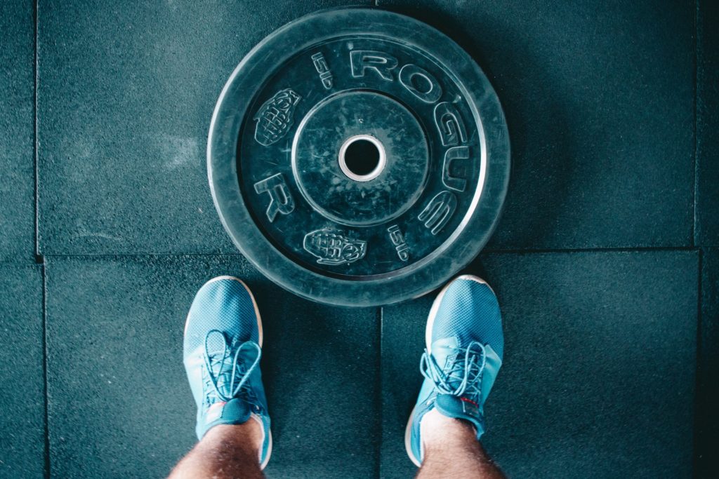 Rogue fitness weight plate on floor