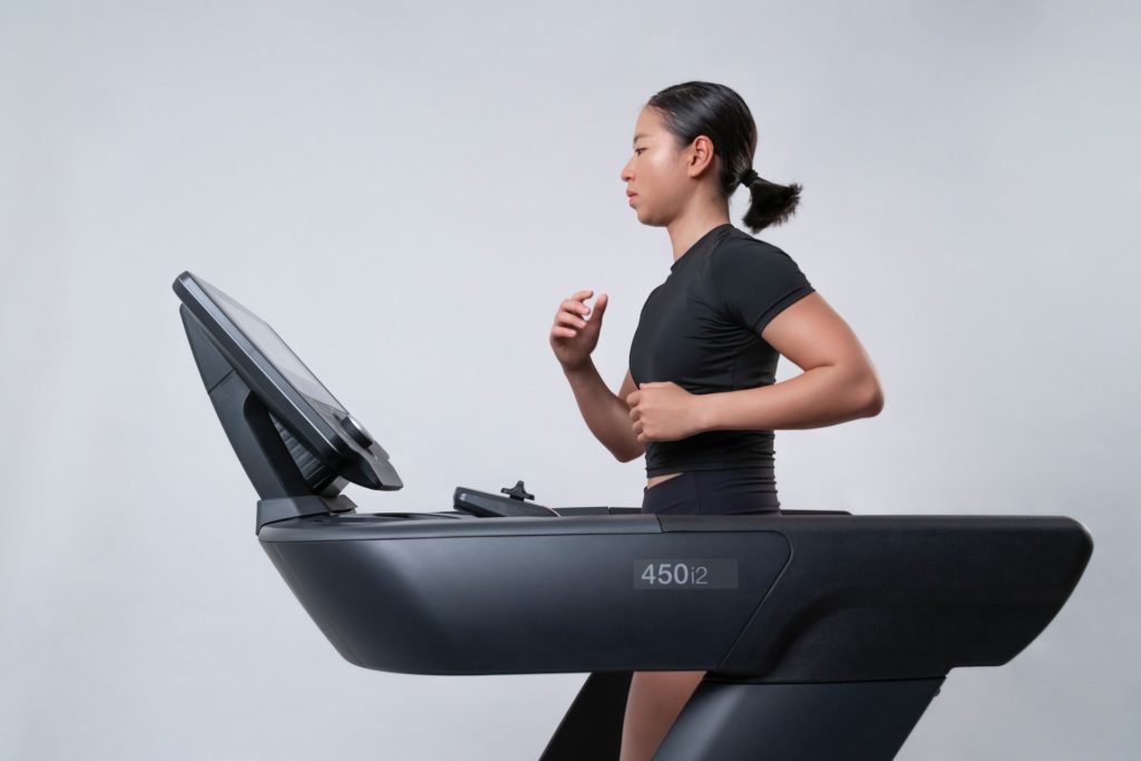 treadmill image for benefits (lady running on a treadmill)
