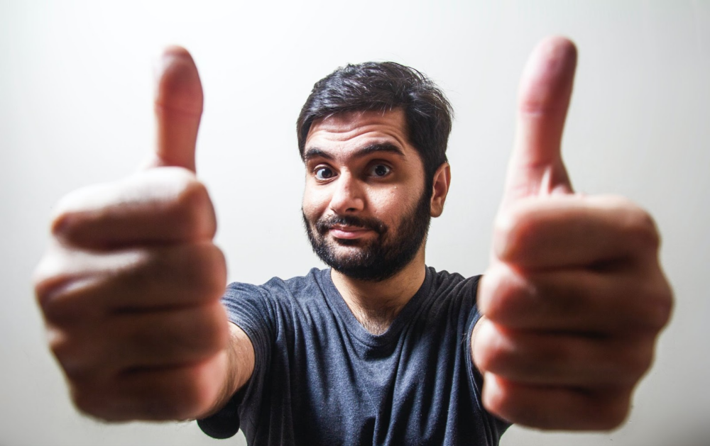 Man giving thumbs up for stretching therapy being a great option