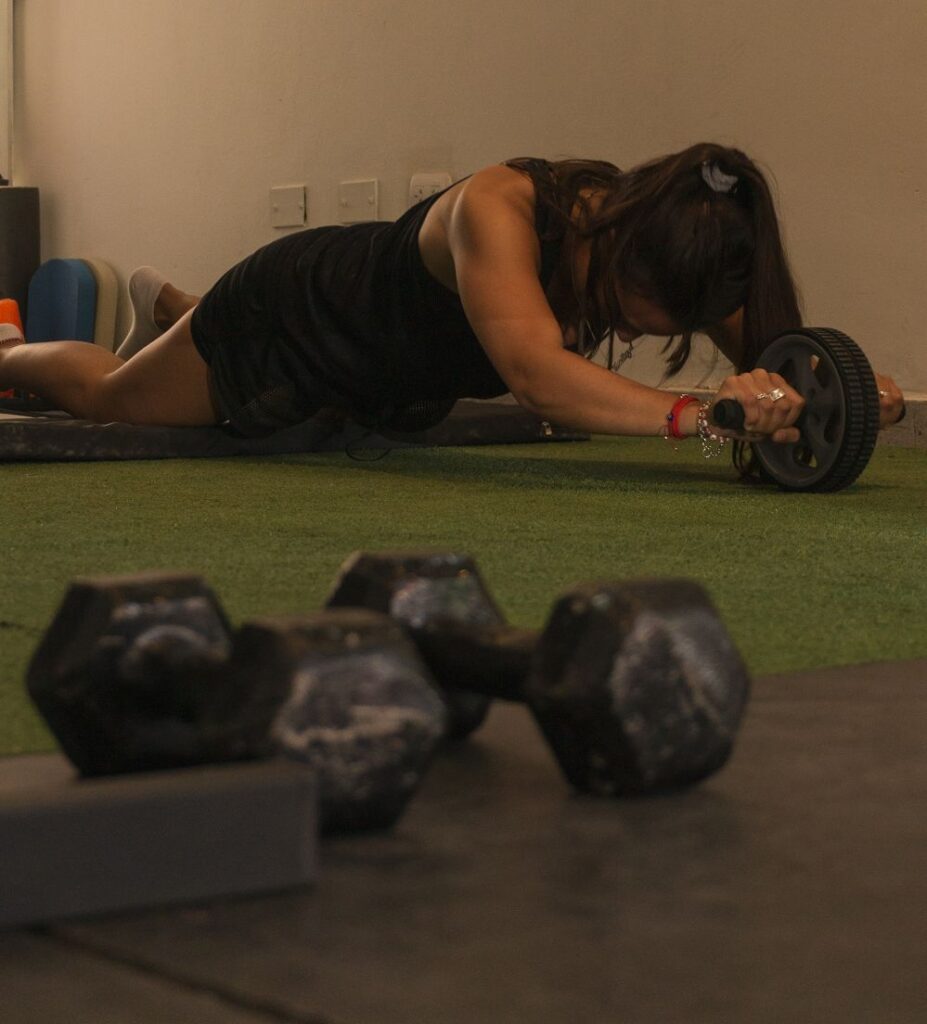 Woman using ab roller